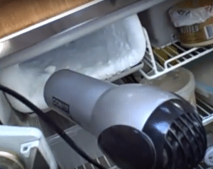 Using a hair dryer to defrost a freezer